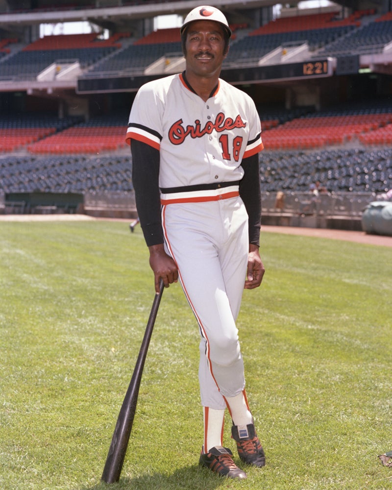 Pat Kelly in Orioles uniform leaning on bat